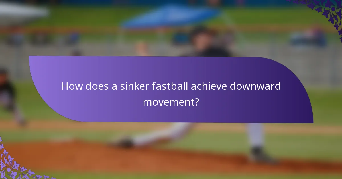 How does a sinker fastball achieve downward movement?